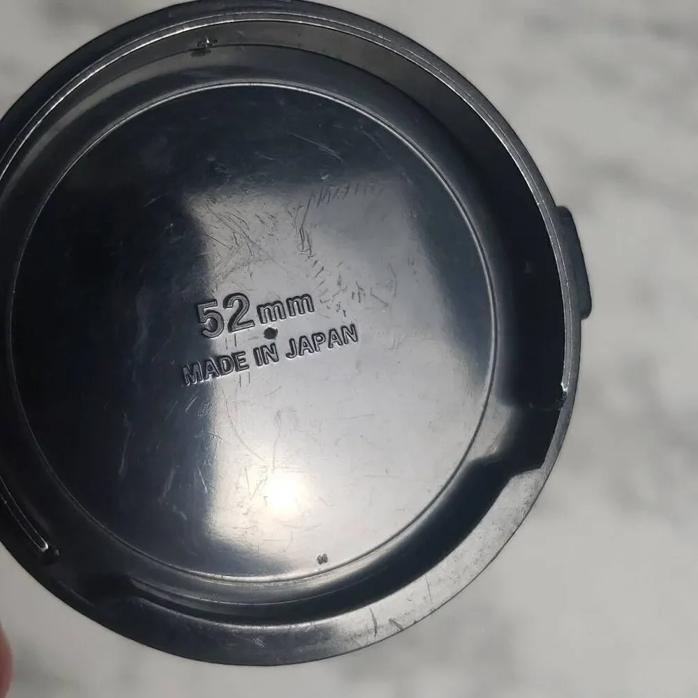 Nikon 52m.‎ Camera Cap